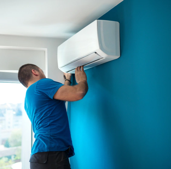 worker installing hvac unit